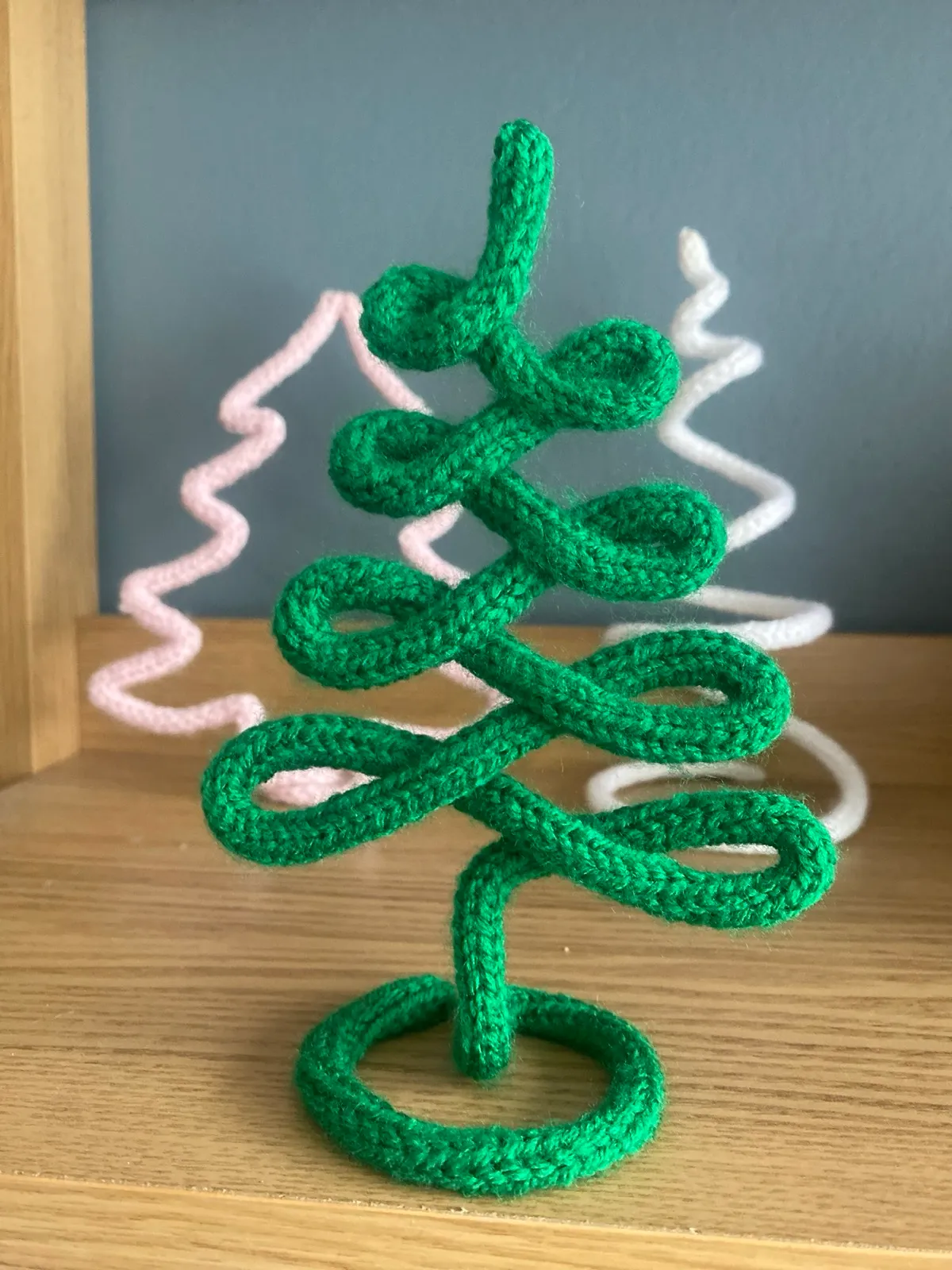 Knitted Christmas tree: A free-standing knitted tree with a swirly or zig-zag shape.