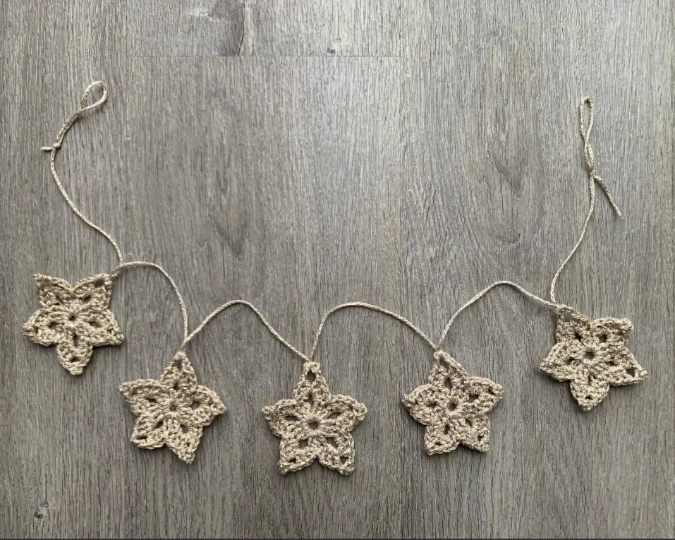 Star garland: A string of crocheted stars in shimmering gold or silver.