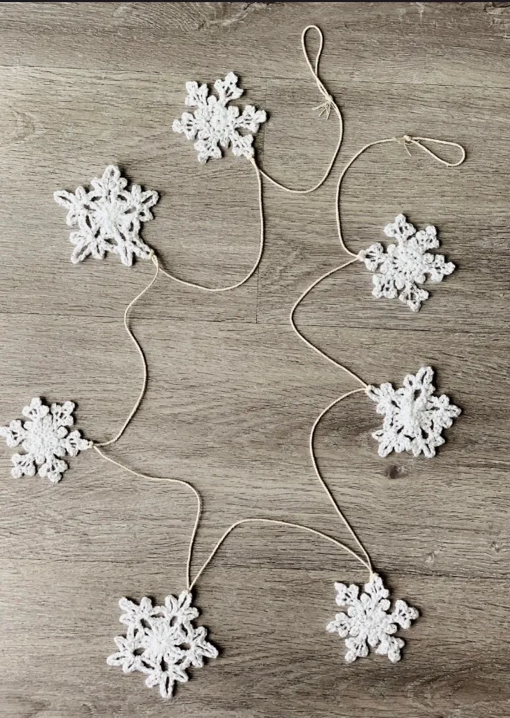 Snowflake garland: A string of crocheted snowflakes in white, silver or gold.